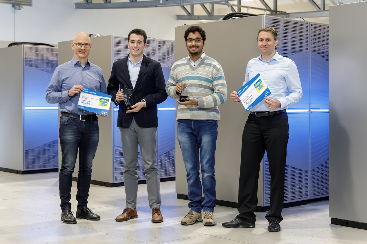 PRACE Summer-of-HPC Award winners in front of supercomputer JUWELS