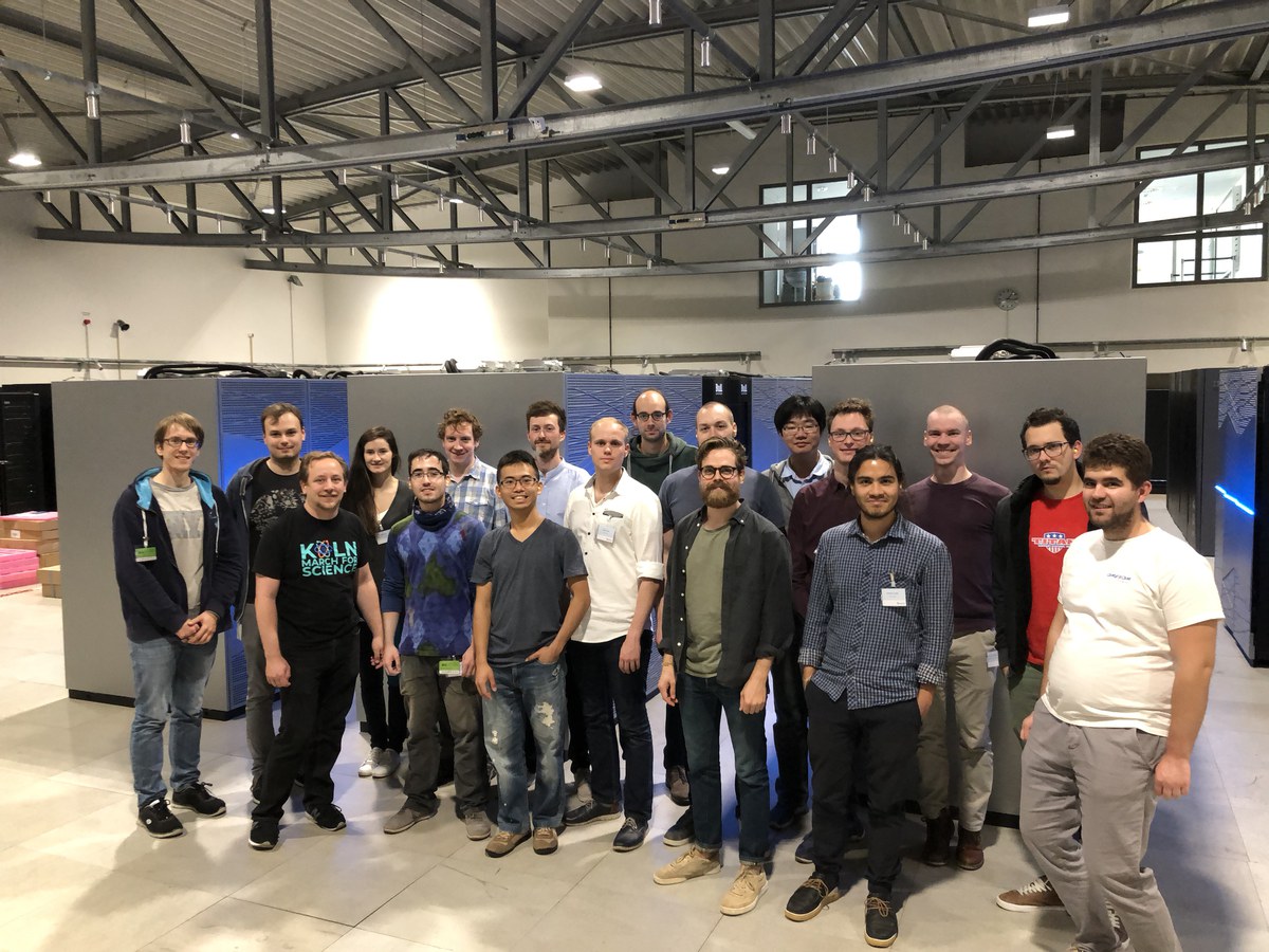 Lattice Practices 2018 participants on the "blinking lights tour". The picture was taken in the JSC machine hall in front of "JUWELS".